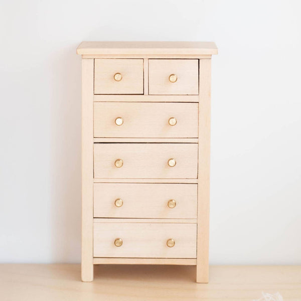 Mouse Sized wooden dresser with gold knobs